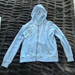 Katie J NYC baby blue ripped sweatshirt